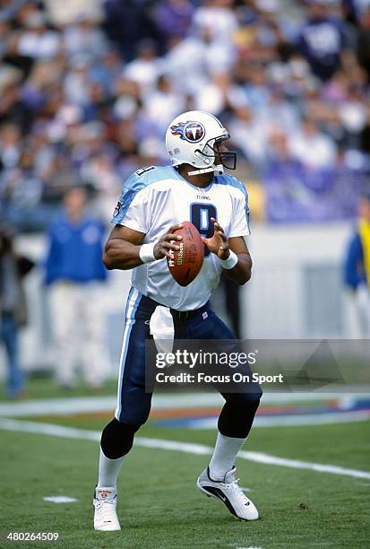 Steve McNair of the Tennessee Titans drops back to pass against the Baltimore Ravens during an NFL football game October 7, 2001 at PSINet Stadium in...