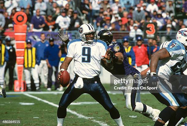 Steve McNair of the Tennessee Titans drops back to pass against the Baltimore Ravens during an NFL football game October 7, 2001 at PSINet Stadium in...