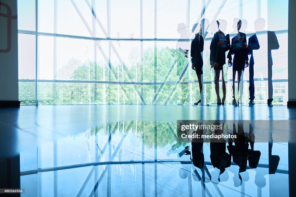 Employees in office lobby