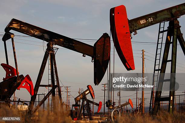 Pump jacks and wells are seen in an oil field on the Monterey Shale formation where gas and oil extraction using hydraulic fracturing, or fracking,...