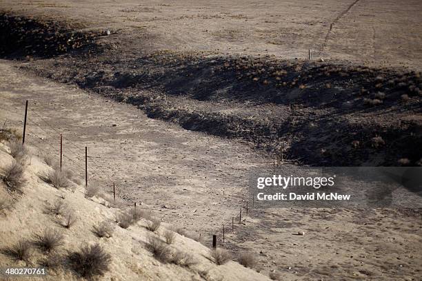 The San Andreas Fault rift zone is seen on the west side of Temblor Ridge which divides it from the oil fields of the Monterey Shale formation where...