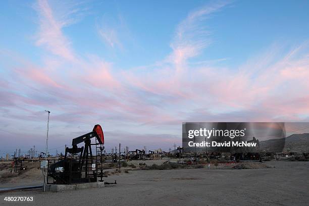 Pump jacks and wells are seen in an oil field on the Monterey Shale formation where gas and oil extraction using hydraulic fracturing, or fracking,...