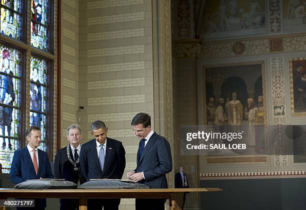 The Netherlands Prime Minister Mark Rutte, US President Barack Obama, Amsterdam Mayor Eberhard van der Laan and Wim Pijbes, Museum director, look at...