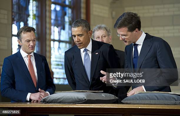 The Netherlands Prime Minister Mark Rutte, US President Barack Obama, Amsterdam Mayor Eberhard van der Laan , and Wim Pijbes, Museum director, look...