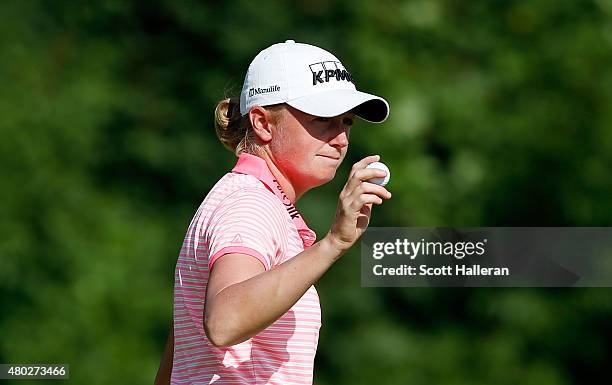 Stacy Lewis of the United States waves to the gallery on the third hole after a birdie putt during the second round of the U.S. Women's Open at...