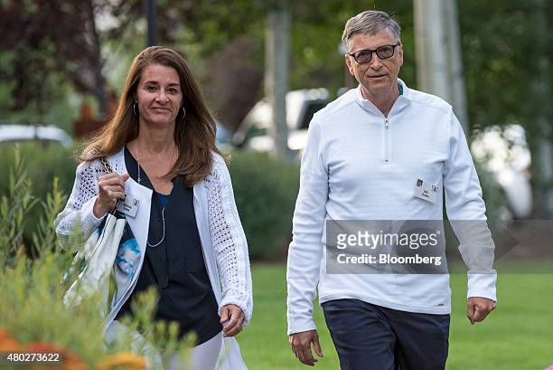 Billionaire Bill Gates, chairman and founder of Microsoft Corp., right and his wife Melinda Gates arrive for a morning session during the Allen & Co....