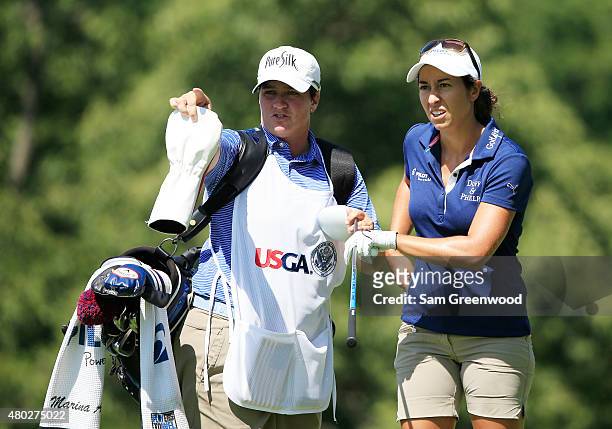 Marina Alex of the United States lines up her tee shot on the ninth hole with her caddie Meaghan Francella during the second round of the U.S....