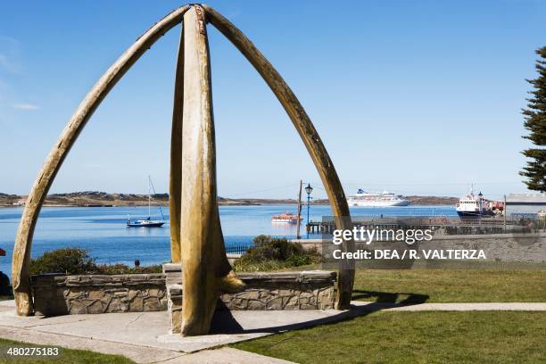 Whalebone Arch and the port, Port Stanley, East Falkland, Falkland Islands, or Malvinas Islands , United Kingdom.