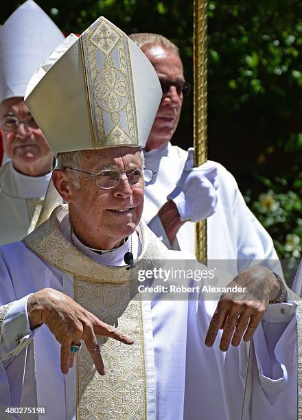 Michael Sheehan, the Archbishop of the Santa Fe Archdiocese, gestures as he walks in a procession on his last day as archbishop in Santa Fe, New...