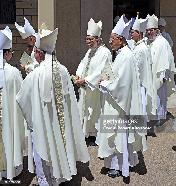 Roman Catholic bishops and archbishops attending the installation mass for a new Archbishop of the Santa Fe Archdiocese in Santa Fe, New Mexico,...