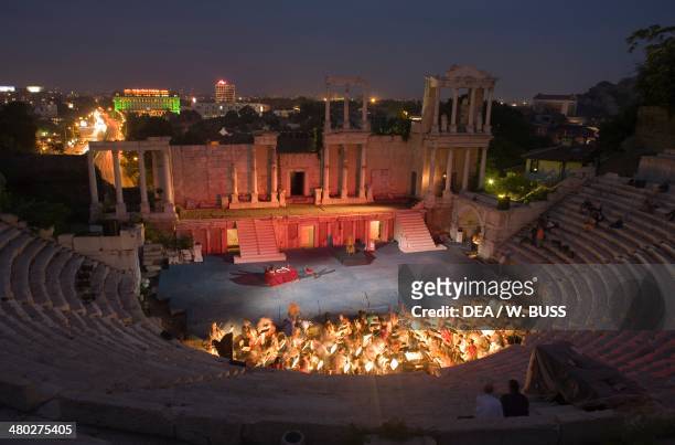 The ancient Plovdiv Roman theatre , Plovdiv, Bulgaria. Night view during a performance.