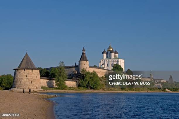 The walls of the Kremlin , 13th century, Velikaja river, and the Trinity cathedral , Pskov, Russia.