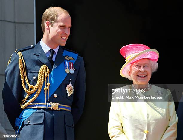 Prince William, Duke of Cambridge and Queen Elizabeth II watch a flypast of Spitfire & Hurricane aircraft from the balcony of Buckingham Palace to...