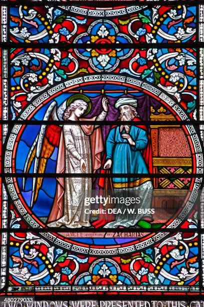 The angel appears to Zechariah, biblical story, stained glass window of Lincoln cathedral, Lincolnshire, United Kingdom.