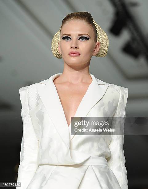 Model walks the runway at the MICHALSKY StyleNite 2015 at Ritz Carlton on July 10, 2015 in Berlin, Germany.