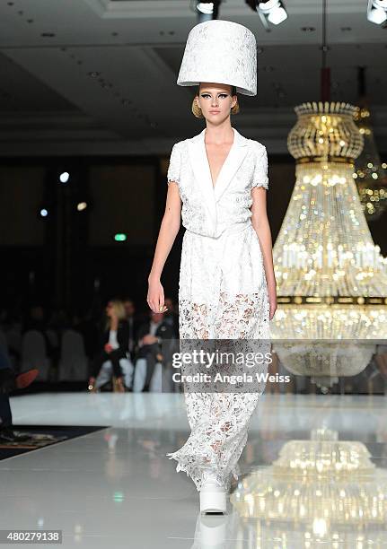 Model walks the runway at the MICHALSKY StyleNite 2015 at Ritz Carlton on July 10, 2015 in Berlin, Germany.