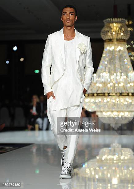 Model walks the runway at the MICHALSKY StyleNite 2015 at Ritz Carlton on July 10, 2015 in Berlin, Germany.