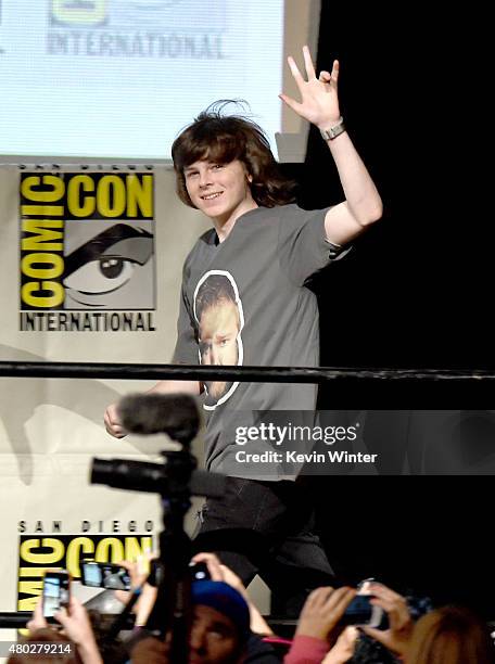 Actor Chandler Riggs walks onstage at AMC's "The Walking Dead" panel during Comic-Con International 2015 at the San Diego Convention Center on July...