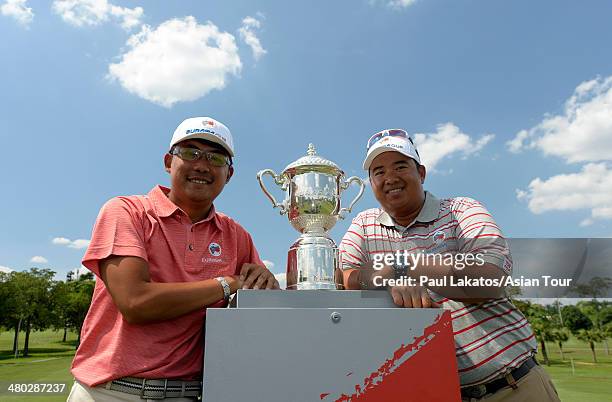 Nicholas Fung of Malaysia and Kiradech Aphibarnrat of Thailand pose with the EurAsia Cup trophy ahead of the EurAsia Cup presented by DRB-HICOM at...