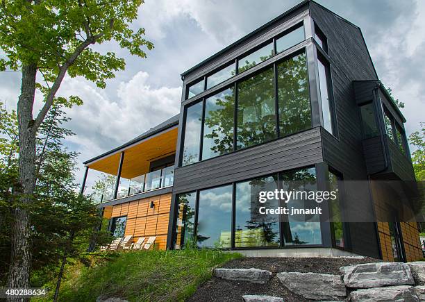 beautiful modern house in the forest, outdoor - model home exterior stock pictures, royalty-free photos & images