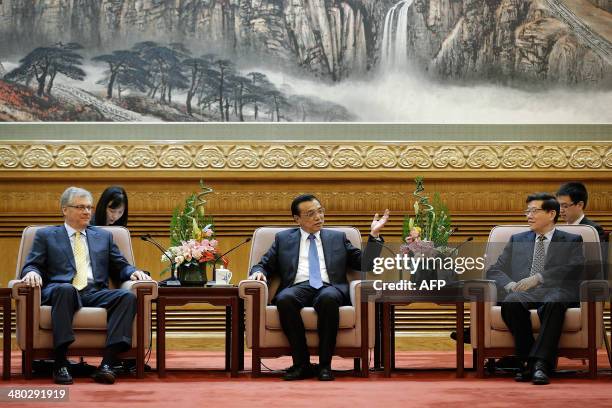 Chinese Premier Li Keqiang speaks alongside Caterpillar Inc. Chairman and ceo Douglas Oberhelman during his meeting with participants of the China...