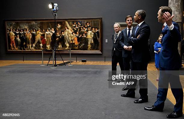 President Barack Obama , Dutch Prime Minister Mark Rutte and Amsterdam mayor Eberhard Van der Laan listen to Rijksmuseum director Wim Pijbes during a...