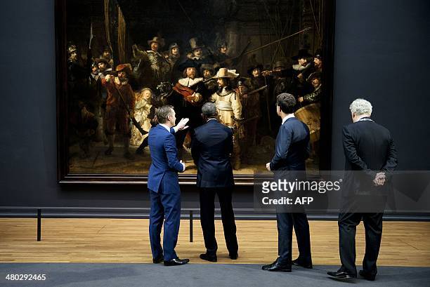 President Barack Obama , Dutch Prime Minister Mark Rutte and Amsterdam mayor Eberhard Van der Laan listen to Rijksmuseum director Wim Pijbes as he...