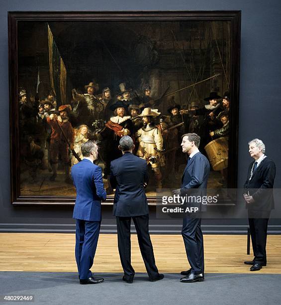 President Barack Obama , Dutch Prime Minister Mark Rutte and Amsterdam mayor Eberhard Van der Laan listen to Rijksmuseum director Wim Pijbes as he...