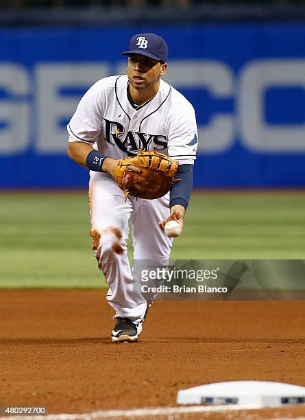 First baseman James Loney of the Tampa Bay Rays fields the ground out by Luis Valbuena of the Houston Astros during the fourth inning of a game on...