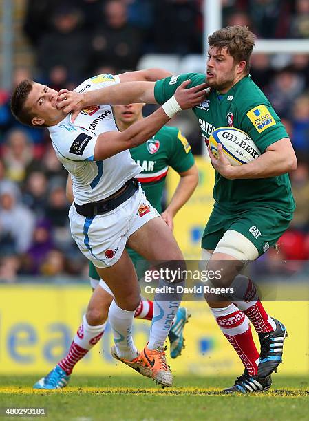 Ed Slater of Leicester holds off Henry Slade during the Aviva Premiership match between Leicester Tigers and Exeter Chiefs at Welford Road on March...