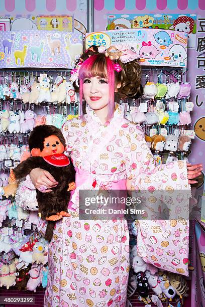 Stall holder poses for a photo at Hyper Japan, the UK's biggest Japanese culture event on July 10, 2015 at The O2 Arena in London, England.
