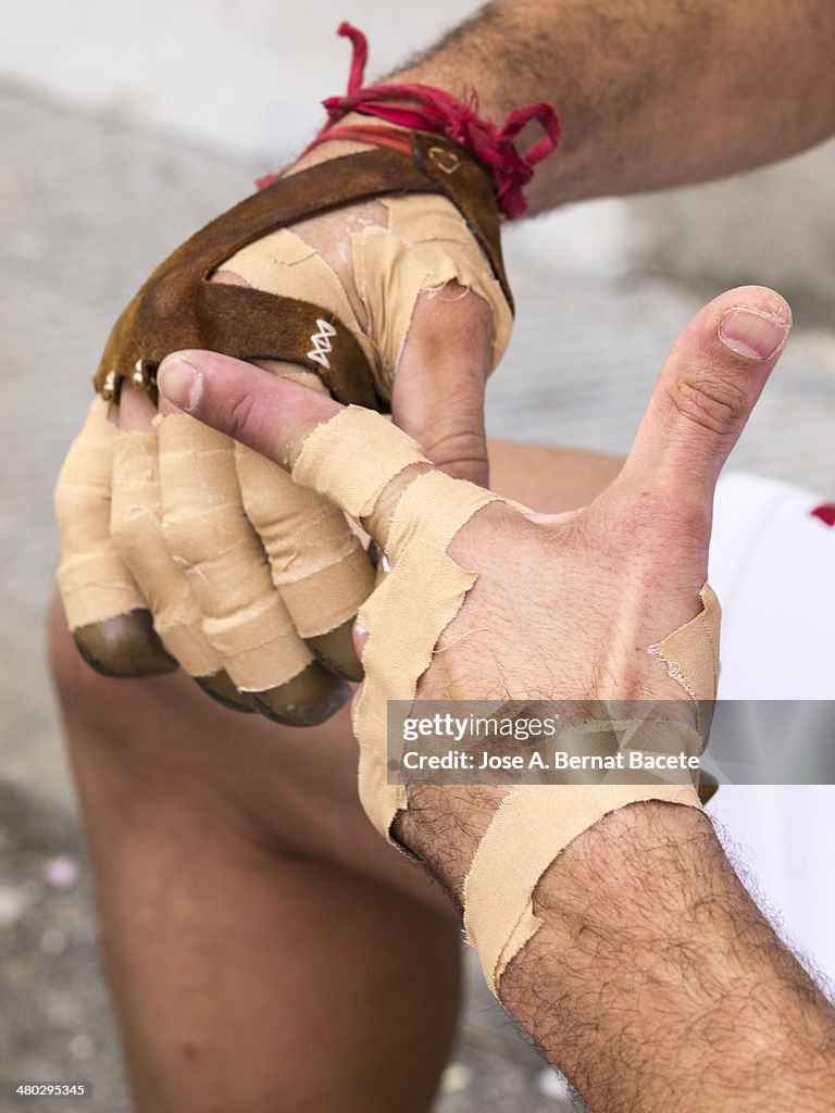 Hands protected from a sportsman of Valencian ball