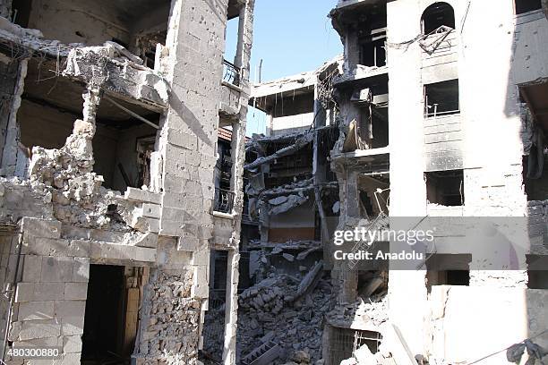 Destroyed buildings are seen after forces connected to the Ansar Al-Sharia operations center attacked buildings containing regime forces in...