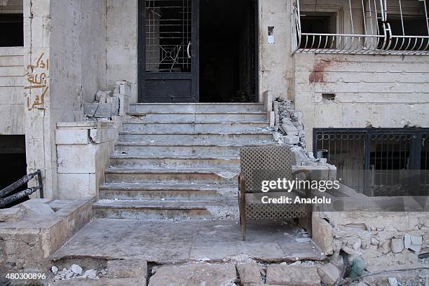 Entrance of a damaged building is seen after forces connected to the Ansar Al-Sharia operations center attacked buildings containing regime forces in...