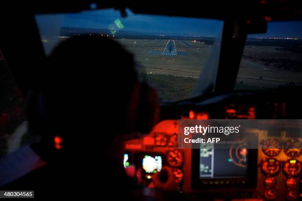 Flying Officer Marc Smith, Co-Pilot of an RAAF AP-3C Orion steers the plane on final approach to Pearce Airbase in Bullsbrook, 35 kms north of Perth...