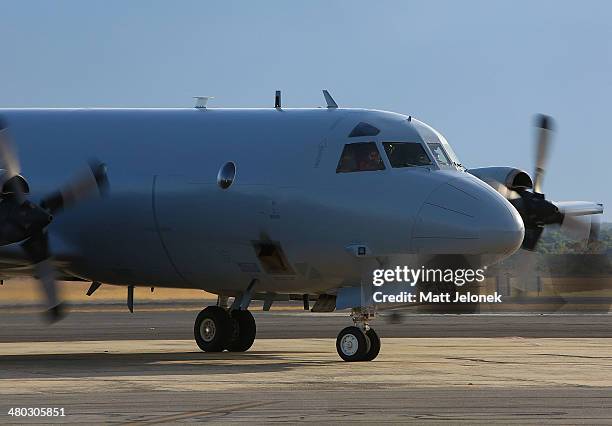 Royal Australian Air Force AP-3C Orion taxis on the tarmac upon its return from a search for Malaysian Airlines flight MH370 over the Indian Ocean,...