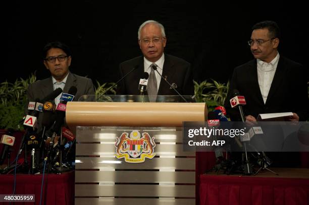 Malaysian Prime Minister Najib Razak delivers a statement on the missing Malaysia Airlines flight MH370 during a press conference at the Putra World...