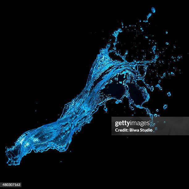 blue water splash on black background - acqua splash foto e immagini stock