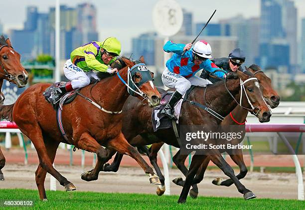 Darren Gauci riding Automatic Choice beats Damien Oliver riding El Greco to win race 1 the Taj Rossi Series Final during Flemington Finals Day at...