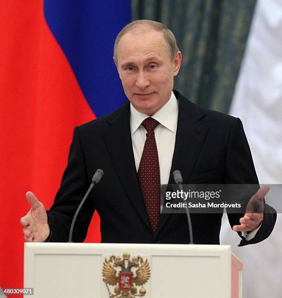 Russian President Vladimir Putin speaks during a state award ceremony honoring participants of the Olympic and Paralympics Games in Sochi in the...