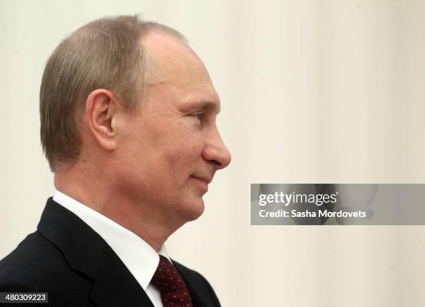 Russian President Vladimir Putin speaks during a state award ceremony honoring participants of the Olympic and Paralympics Games in Sochi in the...