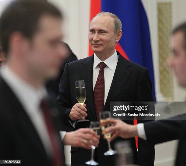 Russian President Vladimir Putin attends a state award ceremony honoring participants of the Olympic and Paralympics Games in Sochi in the Kremlin,...