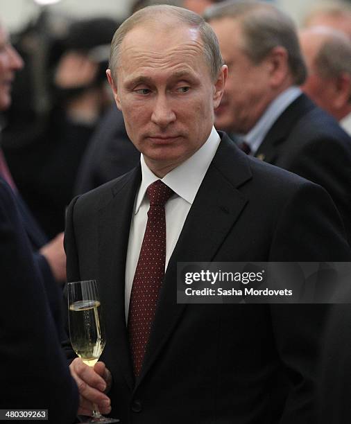 Russian President Vladimir Putin attends a state award ceremony honoring participants of the Olympic and Paralympics Games in Sochi in the Kremlin,...