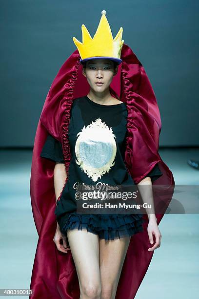 Model showcases designs on the runway during the Singapore Designers Showcase show as part of Seoul Fashion Week A/W 2014 on March 24 in Seoul, South...