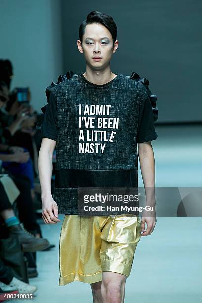 Model showcases designs on the runway during the Singapore Designers Showcase show as part of Seoul Fashion Week A/W 2014 on March 24 in Seoul, South...