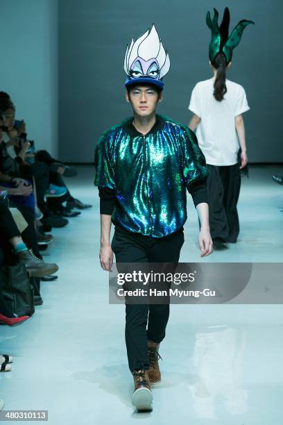 Model showcases designs on the runway during the Singapore Designers Showcase show as part of Seoul Fashion Week A/W 2014 on March 24 in Seoul, South...