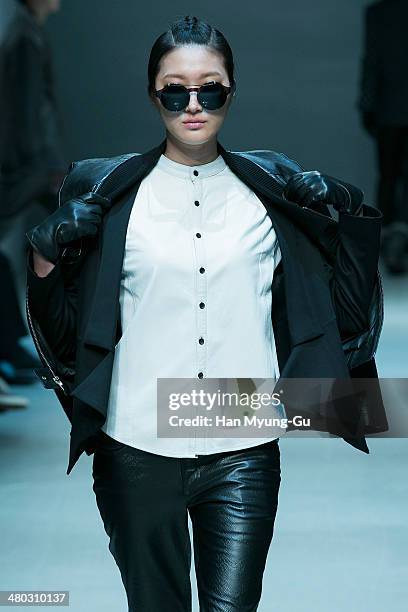 Model showcases designs on the runway during the Singapore Designers Showcase show as part of Seoul Fashion Week A/W 2014 on March 24 in Seoul, South...