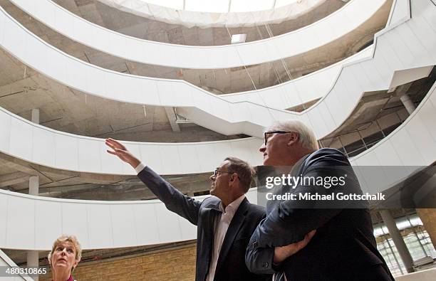 German Foreign Minister Frank-Walter Steinmeier visits next to a construction manager the construction site of the new building of the departments...
