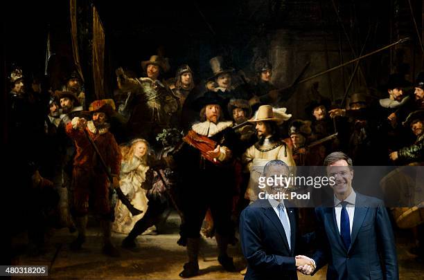 President Barack Obama shakes hands with Prime Minister of the Netherlands Mark Rutte in front of Rembrandt's 'The Night Watch' as they visit the...
