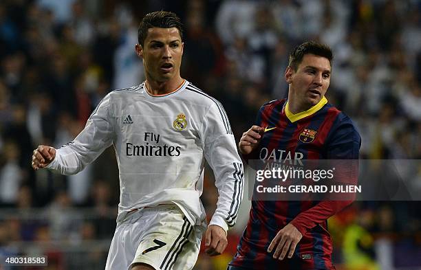 Real Madrid's Portuguese forward Cristiano Ronaldo and Barcelona's Argentinian forward Lionel Messi look on during the Spanish league "Clasico"...